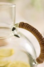 Cane Handle Glass Carafe – Hand-Crafted Round Glass Pitcher with Natural Woven Handle - Image 2