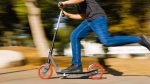 Razor Carbon Lux Kick Scooter - Red/Black, Spoked Large Wheels, Folding Scooter for Up to 220 lbs - Image 4